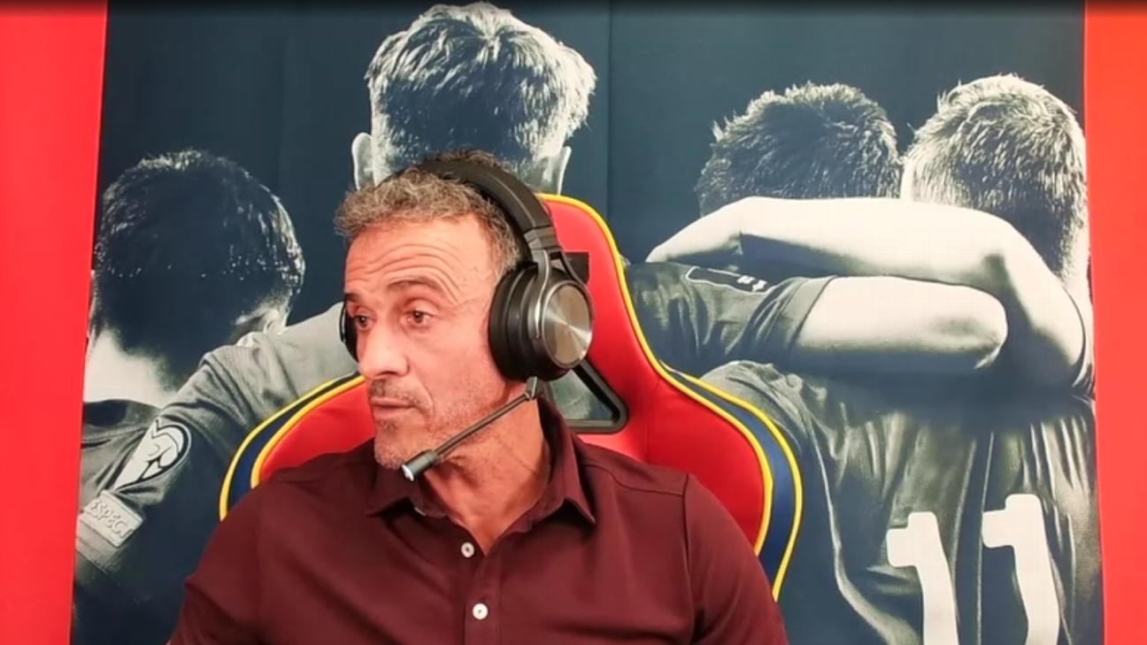 Luis Enrique, a man in his 50s, wears a gaming headset and sits in a gaming chair talking to a camera by himself