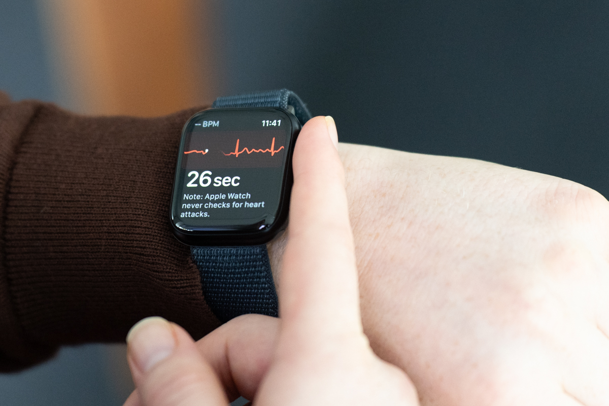 Apple Watch Series 9 on a wrist, showing an ECG being taken