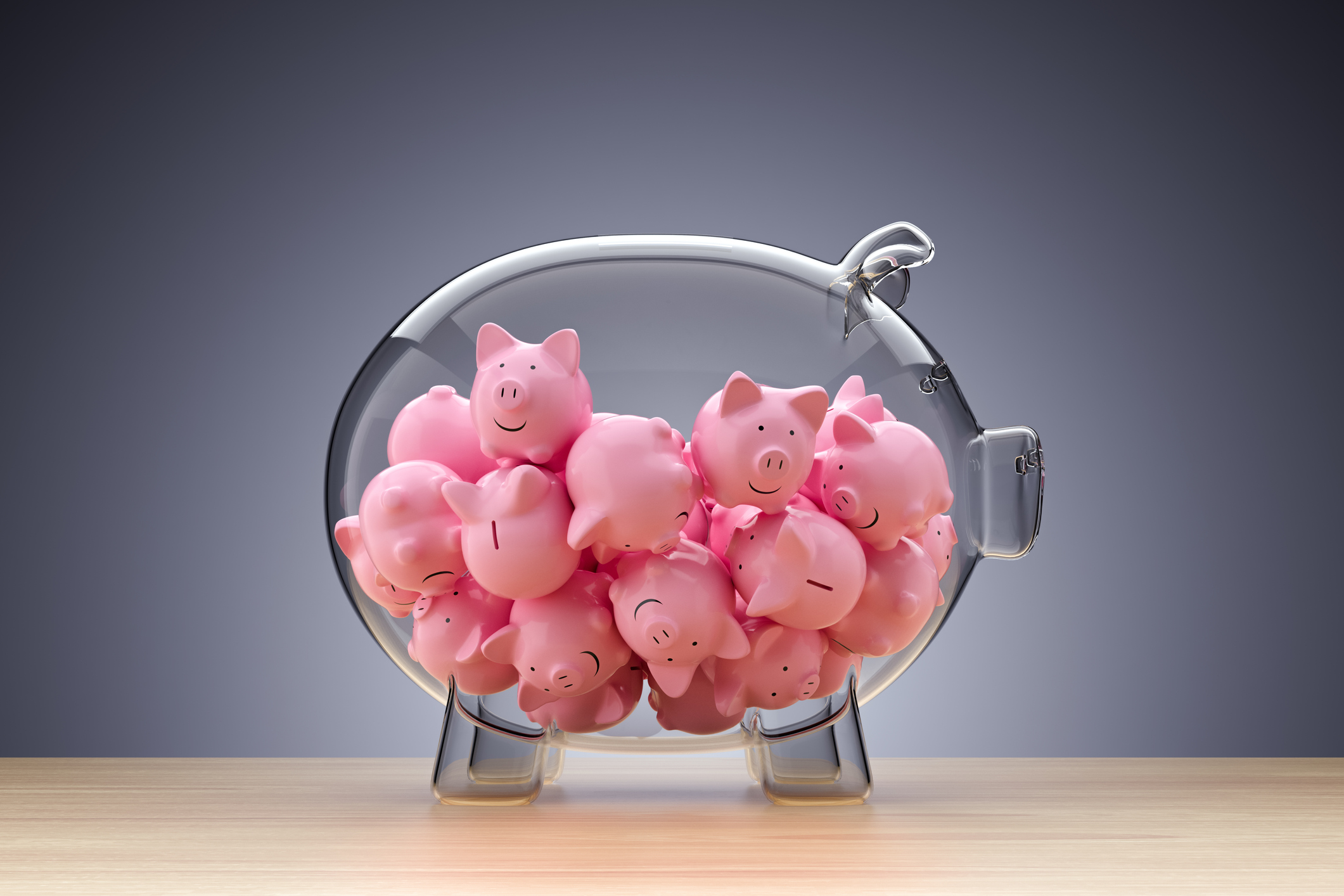 glass piggy bank full of little pink piggies