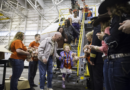 United fantasy flight takes more than 100 kids to visit Santa in Denver airport hangar transformed into the North Pole