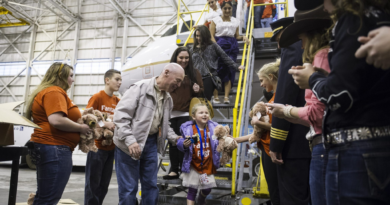 United fantasy flight takes more than 100 kids to visit Santa in Denver airport hangar transformed into the North Pole