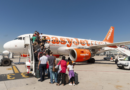 EasyJet halves losses amid lower fuel costs and package holiday boost. ‘We have one million more customers already booked’ says CEO